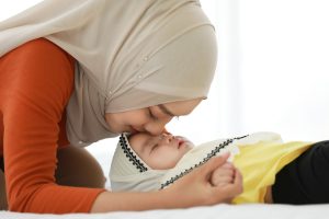 Immigrant with her sleeping child