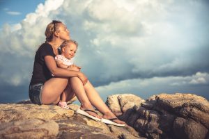 woman with child looking happy through legal separation